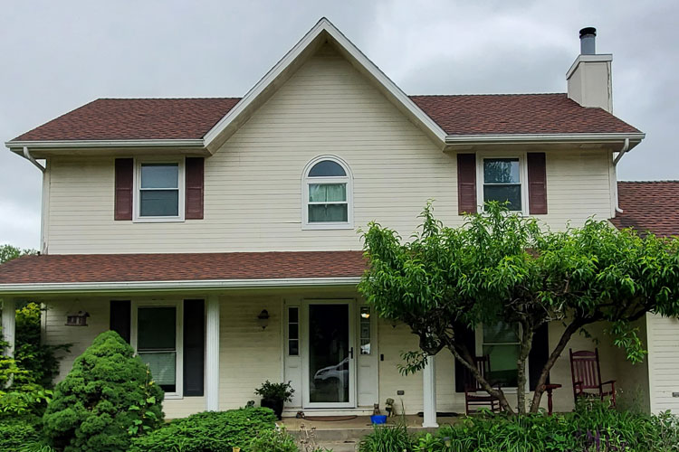 Before house with beige siding